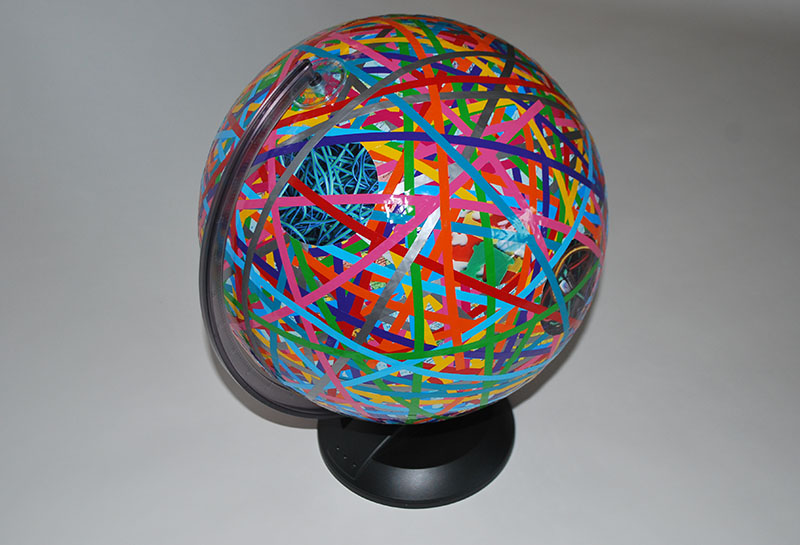 Spinning globe, vinyl color stripes & prints / 20” diam x 25” tall (aprox) /2009 /